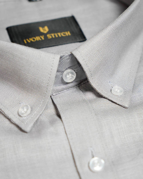 Gray shirt with collar and buttons, featuring the 'Ivory Stitch' brand label.