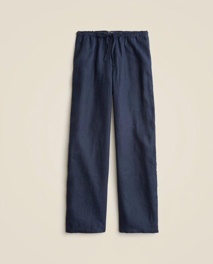 Navy blue pants with a drawstring on a beige background